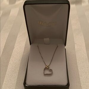Belk's Heart surrounded with CZ Diamonds on 18” .925 silver necklace.